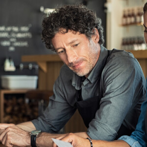 a partner closing a deal with a potential customer on equipment financing