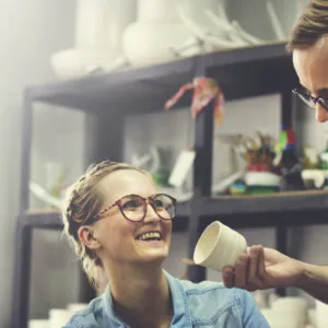man and woman small business owners talking about working capital loans in their business plan