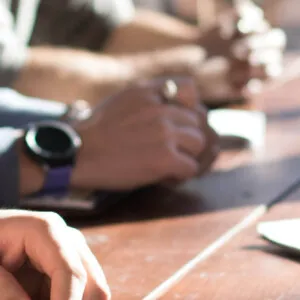 Hands at a business meeting table