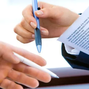 Business hands with pens