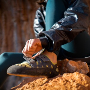 A,Young,Girl,Puts,On,Special,Climbing,Shoes,On,Her