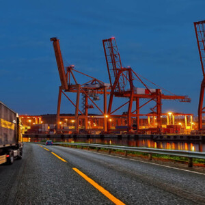 Nighttime photo of cranes at shipping docks