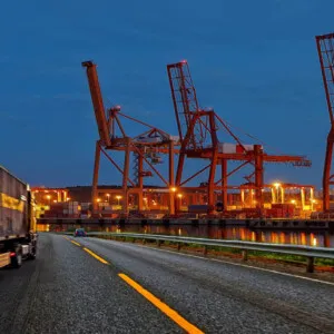 Nighttime photo of cranes at shipping docks